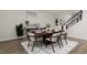 Bright dining room with wood table, gray chairs, and modern art at 940 Myers Point Dr # 36, Morrisville, NC 27560