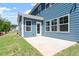Backyard with grass and patio with large windows overlooking the trees at 119 Augusta Pond Way # 147, Raleigh, NC 27603