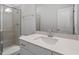 Clean, well-lit bathroom with white countertops, a glass-enclosed shower, and white fixtures at 119 Augusta Pond Way # 147, Raleigh, NC 27603