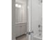 Bright bathroom features a shower and large vanity with white cabinets at 119 Augusta Pond Way # 147, Raleigh, NC 27603