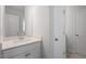 Bright bathroom featuring white cabinetry, modern fixtures, and a tiled floor at 119 Augusta Pond Way # 147, Raleigh, NC 27603