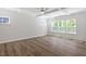 Bright bedroom featuring a ceiling fan, hardwood floors, and light streaming through windows at 119 Augusta Pond Way # 147, Raleigh, NC 27603