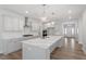 Modern kitchen featuring quartz countertops, stainless steel appliances and lots of natural light at 119 Augusta Pond Way # 147, Raleigh, NC 27603