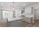 Modern kitchen featuring quartz countertops, stainless steel appliances and lots of natural light at 119 Augusta Pond Way # 147, Raleigh, NC 27603