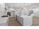 Modern kitchen featuring quartz countertops, stainless steel appliances and lots of natural light at 119 Augusta Pond Way # 147, Raleigh, NC 27603