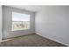 Bright bedroom with large window and carpet at 207 Chesapeake Commons Street # 80, Garner, NC 27529