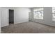 Spacious bedroom with carpet, large window, and walk-in closet at 207 Chesapeake Commons Street # 80, Garner, NC 27529