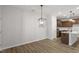 Dining room with hardwood floors and modern chandelier at 207 Chesapeake Commons Street # 80, Garner, NC 27529