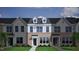 Attractive two-story townhome with gray siding and a charcoal roof at 207 Chesapeake Commons Street # 80, Garner, NC 27529