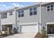 Attached garage with driveway and landscaping at 207 Chesapeake Commons Street # 80, Garner, NC 27529