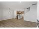 Open concept kitchen with island and hardwood floors at 207 Chesapeake Commons Street # 80, Garner, NC 27529