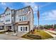 Front view of three-story townhouses with attached garages at 2101 Lambert Rd # 61, Cary, NC 27519