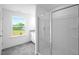 Bright bathroom featuring a tiled floor, granite counter and a glass enclosed shower at 289 Hank Way, Angier, NC 27501