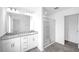 Modern bathroom with double vanity, granite countertop, and glass-enclosed shower at 289 Hank Way, Angier, NC 27501