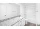 The bathroom features a large mirror, a granite countertop and a shower/tub combo at 289 Hank Way, Angier, NC 27501