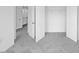 Bedroom featuring carpet flooring, a closet, and bright white walls at 289 Hank Way, Angier, NC 27501