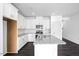 Contemporary kitchen features white cabinets, granite countertops, stainless steel appliances, and a center island at 289 Hank Way, Angier, NC 27501
