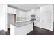 Modern kitchen features white cabinets, granite countertops, stainless steel appliances, and a center island at 289 Hank Way, Angier, NC 27501