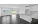 Bright open-concept living room and kitchen with island and stainless steel appliances at 289 Hank Way, Angier, NC 27501