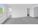 The primary bedroom has carpet and access to the ensuite bathroom and walk-in closet at 289 Hank Way, Angier, NC 27501