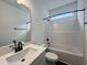 Bathroom with white vanity, tub, and black fixtures at 141 Greenview St, Clayton, NC 27520