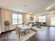 Virtually staged dining area with table and chairs, and adjacent living room at 141 Greenview St, Clayton, NC 27520