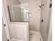 Modern bathroom with a large walk-in shower and hexagon tile floor at 100 Firefly Ln, Louisburg, NC 27549