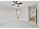Spacious bedroom featuring plush carpeting and multiple doorways for easy access at 100 Firefly Ln, Louisburg, NC 27549