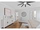 Well-lit bedroom with ceiling fan and decorative rug at 100 Firefly Ln, Louisburg, NC 27549
