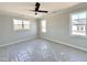 Bright bedroom with neutral walls, carpeting, and multiple windows at 100 Firefly Ln, Louisburg, NC 27549