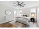 Serene bedroom with decorative rug and a large ceiling fan at 100 Firefly Ln, Louisburg, NC 27549