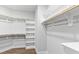 Walk-in closet with plenty of shelves and hanging storage at 100 Firefly Ln, Louisburg, NC 27549