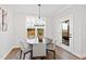 Intimate dining room with wood floors and views of the outdoor living area at 100 Firefly Ln, Louisburg, NC 27549