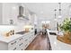 Well-equipped kitchen with a dining area, stainless steel appliances, and custom cabinetry at 100 Firefly Ln, Louisburg, NC 27549