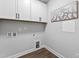 Utility room with white walls and cabinetry, and laundry hookups at 100 Firefly Ln, Louisburg, NC 27549