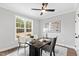 Bright office space with modern ceiling fan, desk, and neutral decor at 100 Firefly Ln, Louisburg, NC 27549