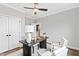 Office featuring a modern ceiling fan, desk, and neutral decor at 100 Firefly Ln, Louisburg, NC 27549