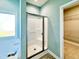 Bathroom showing a view of the shower, bathtub, and walk-in closet at 21 Oakbridge Way, Pikeville, NC 27863