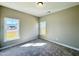 Bright bedroom with two windows and neutral carpet, providing ample natural light at 21 Oakbridge Way, Pikeville, NC 27863