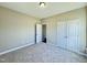 Inviting carpeted bedroom with a double closet and an open doorway, showing a clean and comfortable space at 21 Oakbridge Way, Pikeville, NC 27863