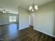 Dining area with hardwood flooring and a chandelier with views of the yard at 21 Oakbridge Way, Pikeville, NC 27863