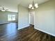 Hardwood-floored dining room with modern light fixtures and neutral wall colors at 21 Oakbridge Way, Pikeville, NC 27863