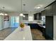 Modern kitchen featuring dark cabinets, stainless steel appliances, and a center island with bar seating at 21 Oakbridge Way, Pikeville, NC 27863