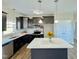 Modern kitchen featuring dark cabinets, stainless steel appliances, and a center island at 21 Oakbridge Way, Pikeville, NC 27863