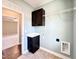 Functional laundry room with custom cabinets, a sink, and plenty of space for organization at 21 Oakbridge Way, Pikeville, NC 27863