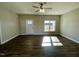 Spacious living room featuring hardwood floors and a large window at 21 Oakbridge Way, Pikeville, NC 27863