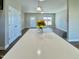 Bright and airy living room featuring hardwood floors, a kitchen island, and natural light at 21 Oakbridge Way, Pikeville, NC 27863