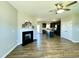 Inviting living room with fireplace, flowing into the kitchen with island and modern features at 21 Oakbridge Way, Pikeville, NC 27863
