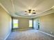 Spacious main bedroom with a decorative ceiling fan and large windows at 21 Oakbridge Way, Pikeville, NC 27863