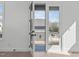 Bright balcony with an open door that lets in natural light and provides a view of the neighborhood at 227 Woodsborough Pl, Raleigh, NC 27601